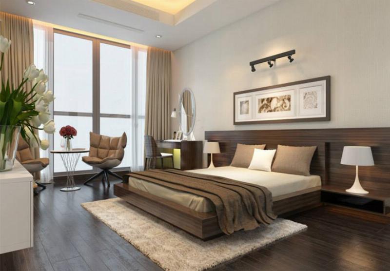 Phòng ngủ sạch sẽ, gọn gàng với tủ quần áo gỗ công nghiệp tối giản, tạo không gian nghỉ ngơi thư thái và có ý thức